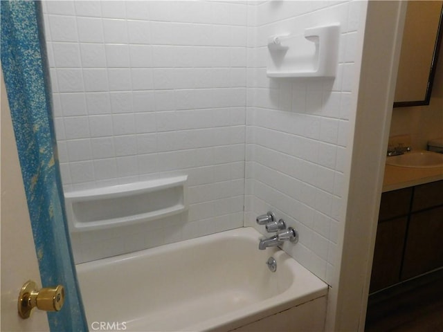 bathroom featuring a sink and shower / tub combo with curtain