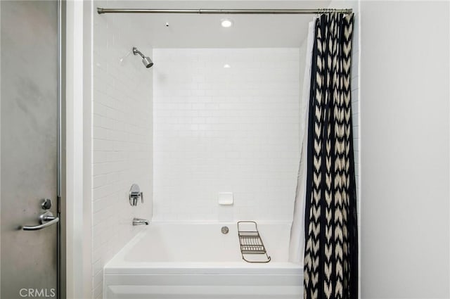 bathroom with shower / bath combination with curtain