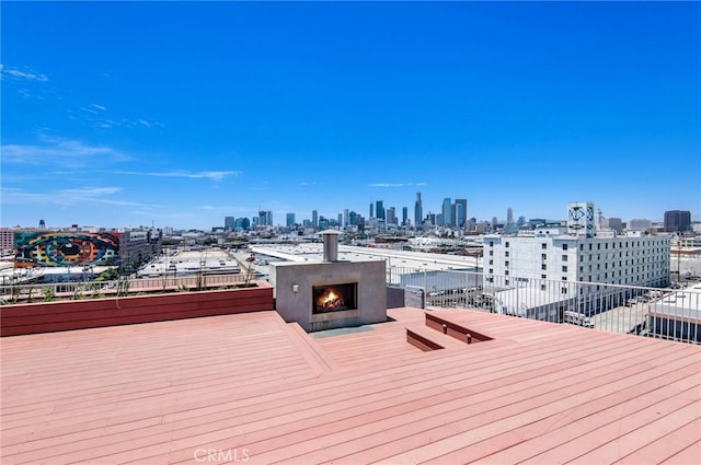 deck featuring an outdoor fireplace