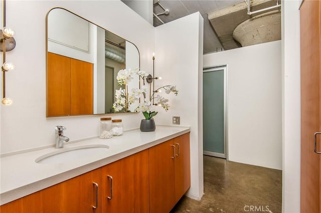 bathroom with vanity and concrete floors