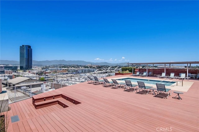 exterior space with a mountain view and a community pool