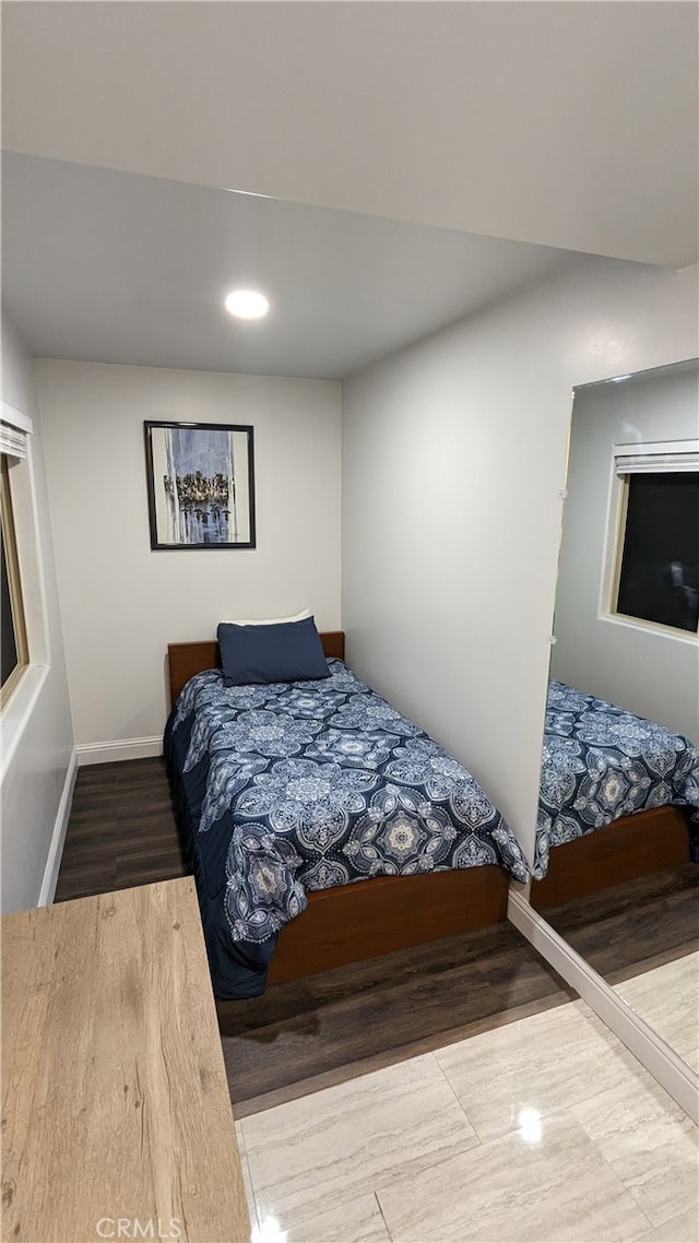 bedroom featuring wood-type flooring