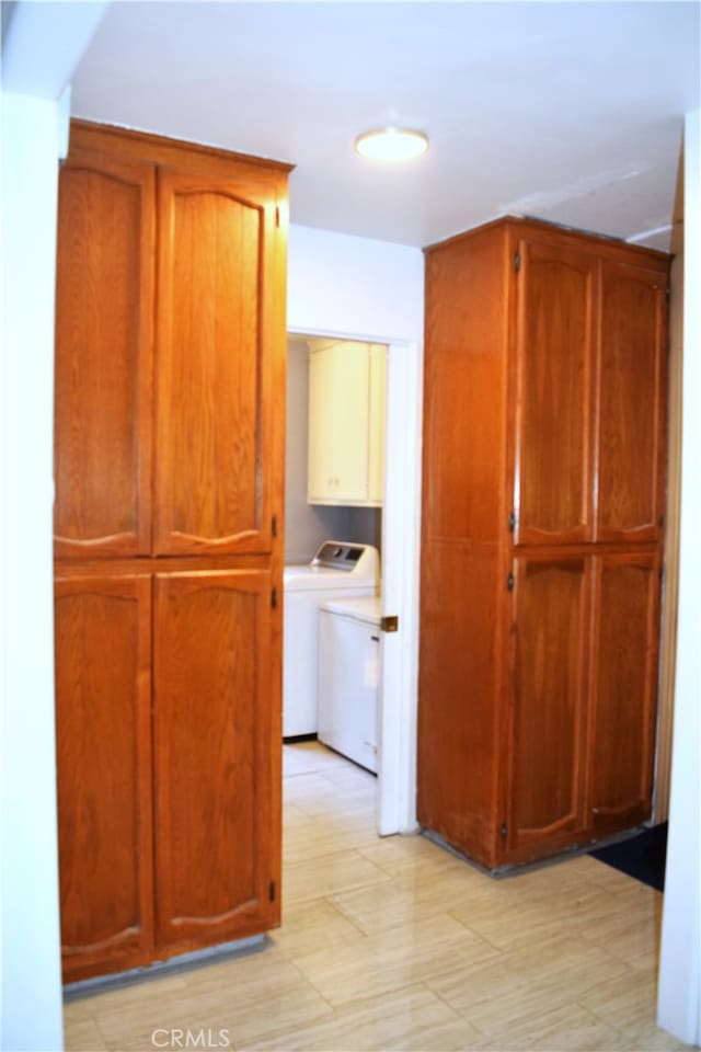 hall with separate washer and dryer