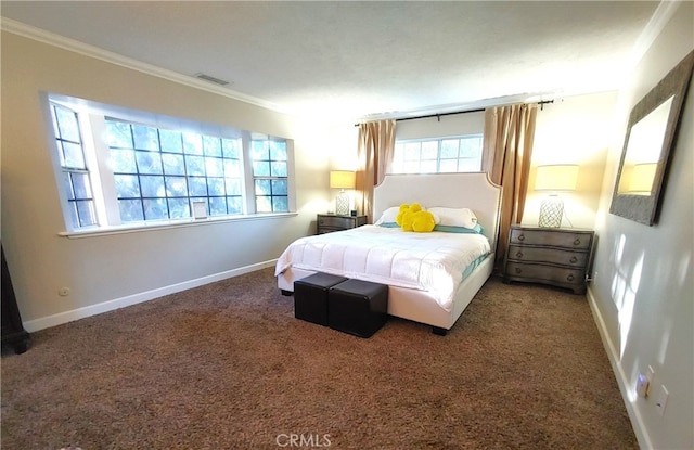 bedroom with ornamental molding and carpet floors