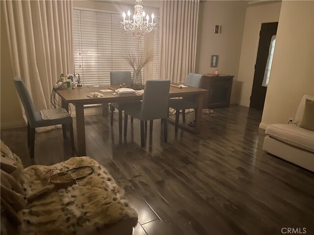 12100 Colima Rd, Whittier, CA 90604 - dining room with dark wood-type flooring and a notable chandelier