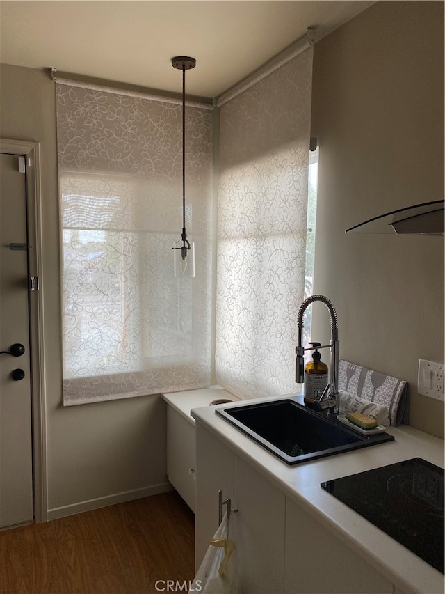 12100 Colima Rd, Whittier, CA 90604 - kitchen featuring hardwood / wood-style floors, sink, and black electric stovetop