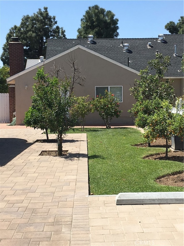 12100 Colima Rd, Whittier, CA 90604 - view of home's exterior featuring a lawn