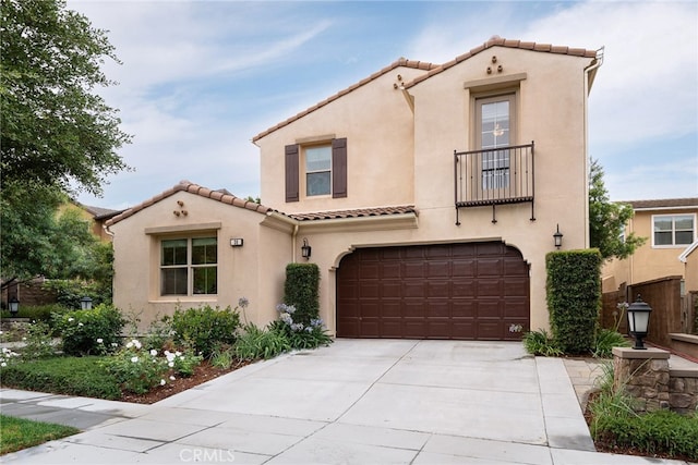 mediterranean / spanish-style home featuring a garage