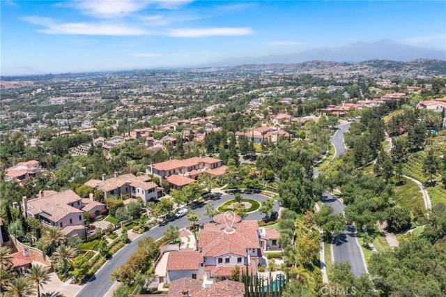 birds eye view of property with a mountain view