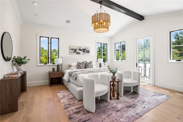 bedroom featuring multiple windows, light hardwood / wood-style floors, and access to exterior