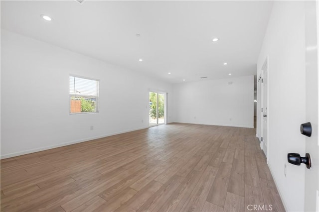 unfurnished room featuring light hardwood / wood-style floors