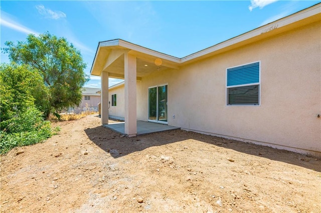 rear view of house with a patio area