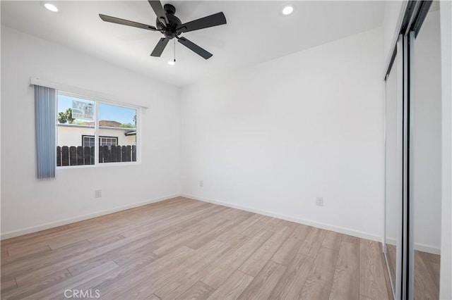 interior space with ceiling fan and light hardwood / wood-style floors