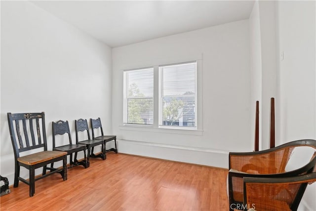 living area with hardwood / wood-style flooring