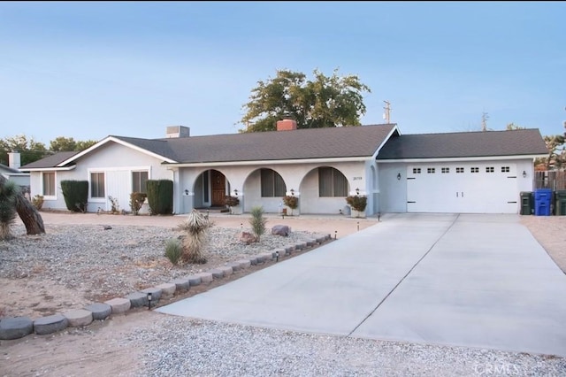 ranch-style house featuring a garage