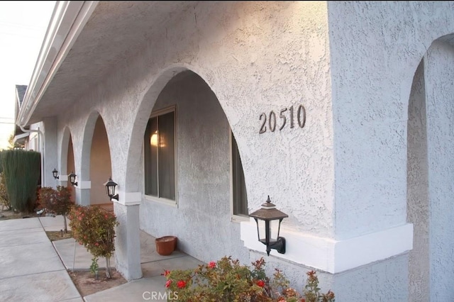 doorway to property with stucco siding