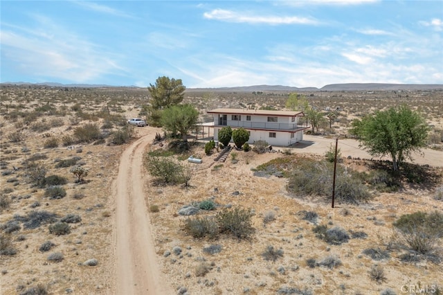 back of property featuring a mountain view