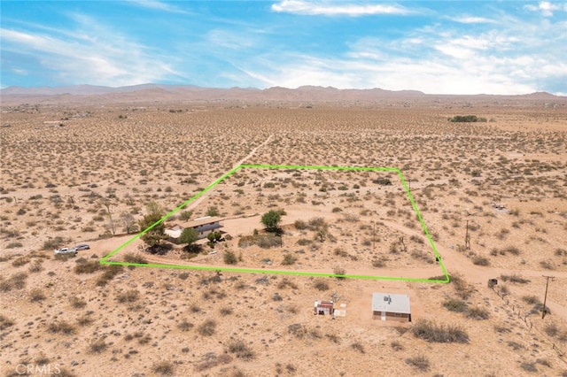 birds eye view of property featuring a mountain view