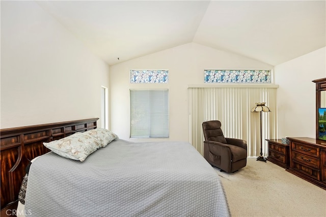 carpeted bedroom featuring lofted ceiling