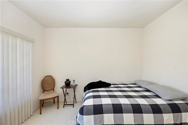 bedroom featuring light carpet