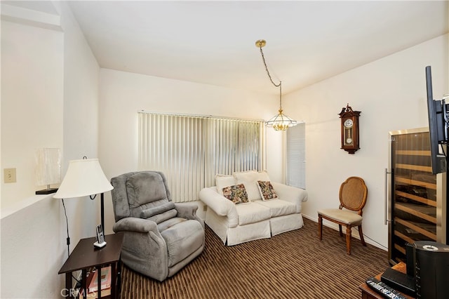 living room with carpet floors and a chandelier