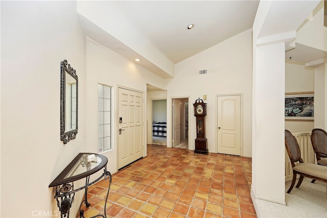 entryway with high vaulted ceiling