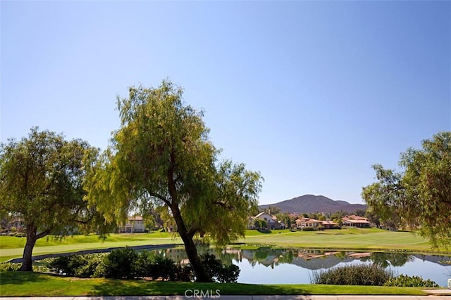 view of home's community with a water and mountain view