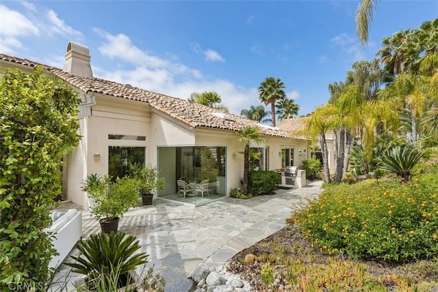 back of house featuring a patio