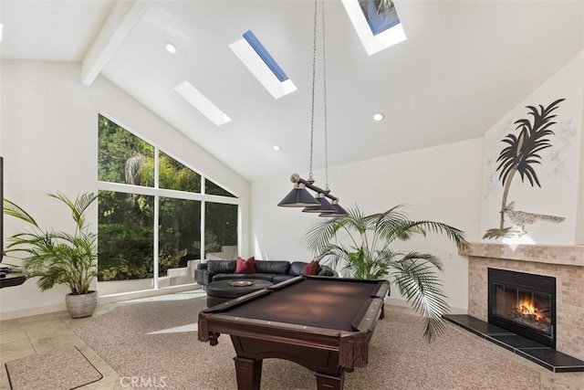 playroom featuring beam ceiling, a fireplace, and high vaulted ceiling