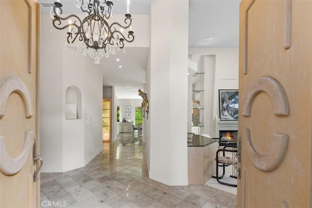 foyer entrance with a chandelier