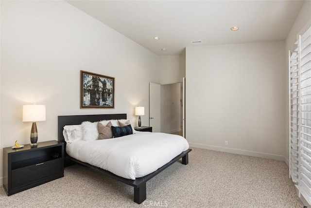 bedroom featuring light carpet