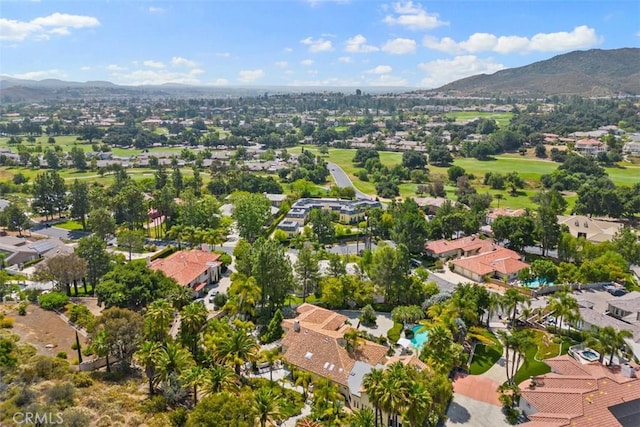 birds eye view of property with a mountain view