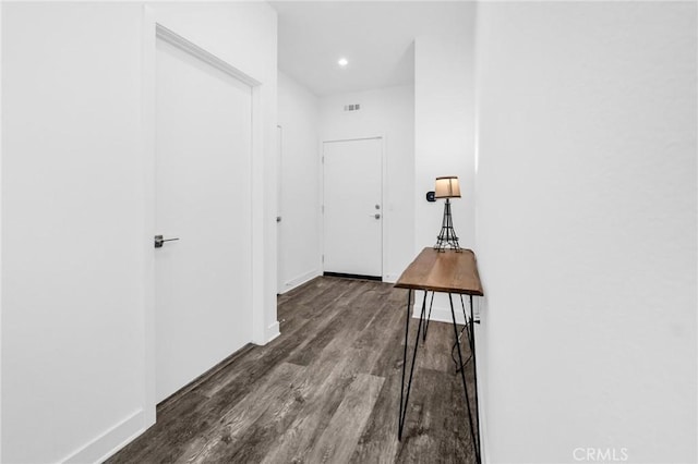 corridor featuring dark wood-type flooring