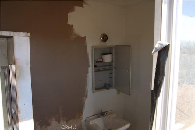 utility room featuring a sink