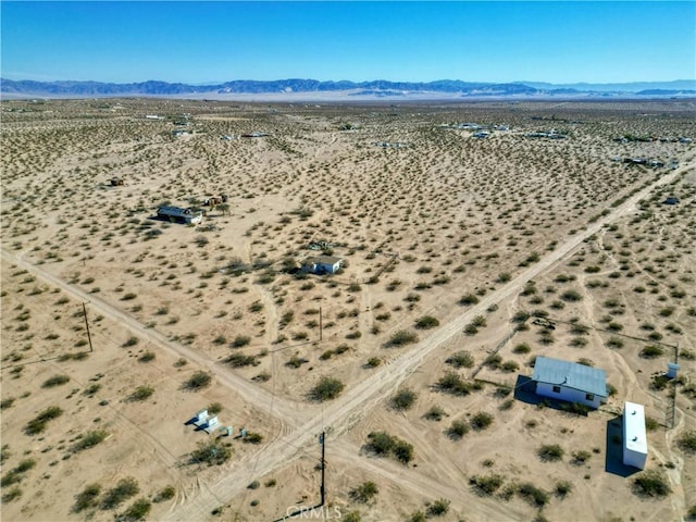 bird's eye view featuring a mountain view and view of desert