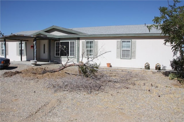 view of front facade featuring stucco siding