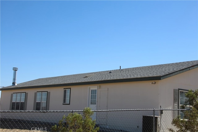 view of side of property with cooling unit