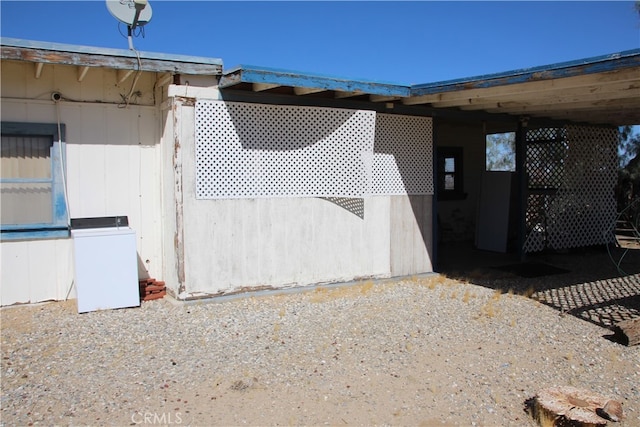 view of side of property with washer / dryer