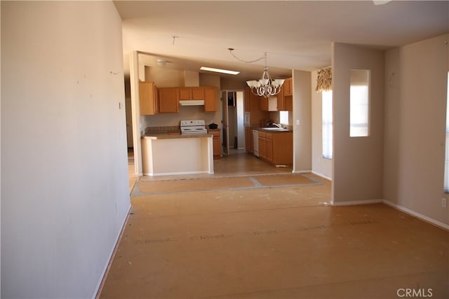 kitchen with a chandelier, hanging light fixtures, white range, and sink