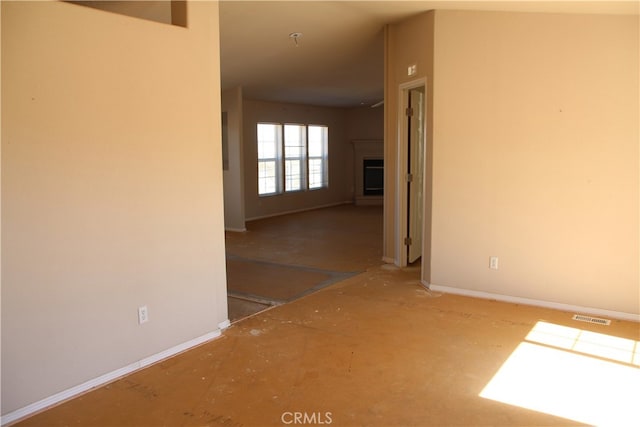 unfurnished room featuring concrete floors