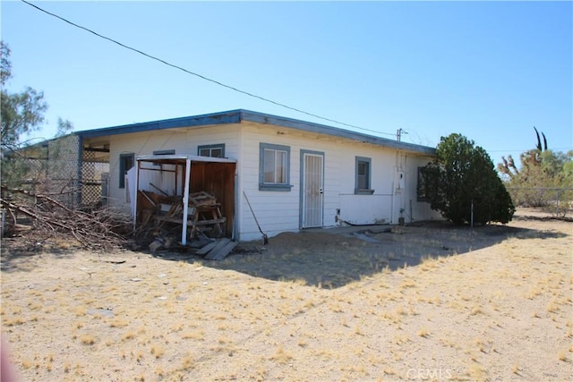 view of outdoor structure with fence