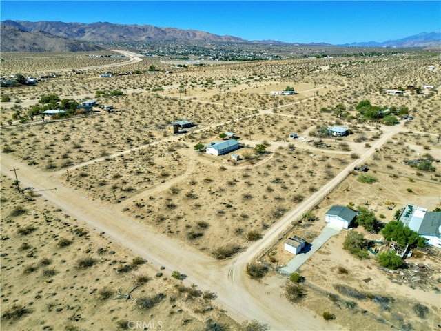 drone / aerial view featuring a mountain view