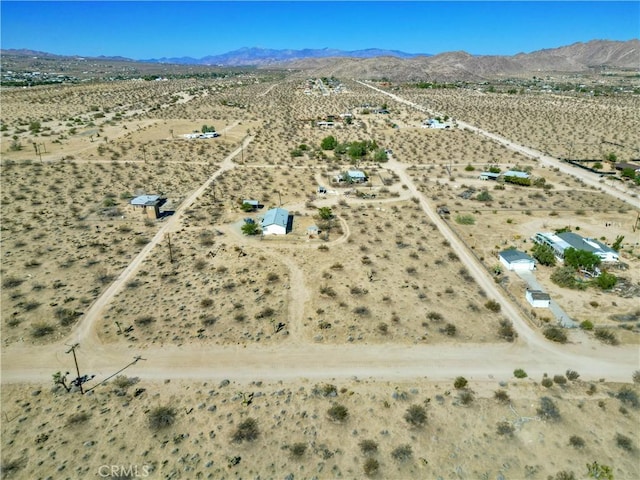 aerial view with a desert view and a mountain view