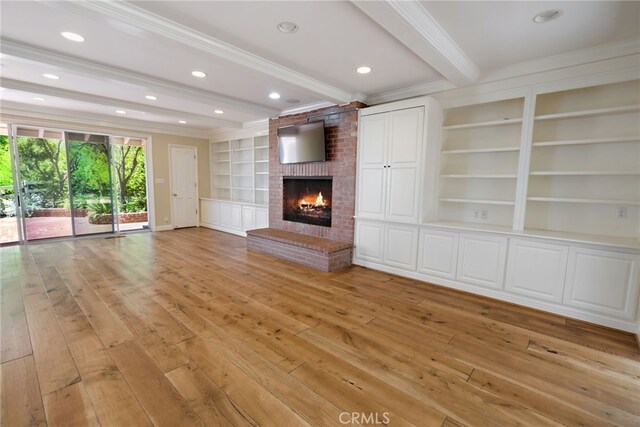 8 Quail Ridge Rd S, Rolling Hills, CA 90274 - unfurnished living room with beamed ceiling, a fireplace, ornamental molding, light wood finished floors, and built in features