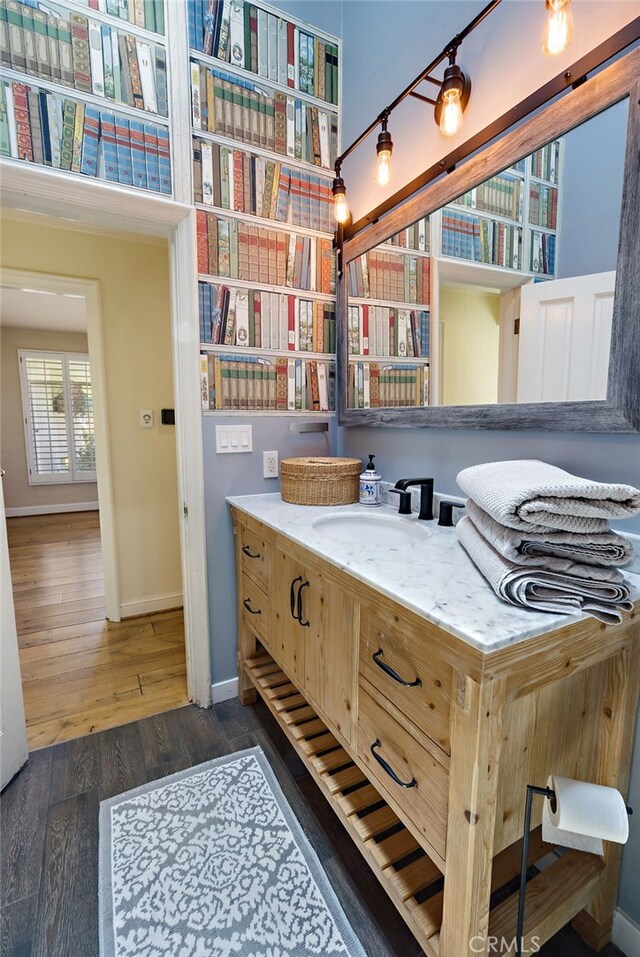 8 Quail Ridge Rd S, Rolling Hills, CA 90274 - bathroom with baseboards, wood finished floors, and vanity
