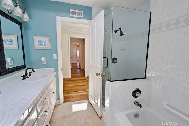 bathroom with vanity, hardwood / wood-style floors, and shower with separate bathtub