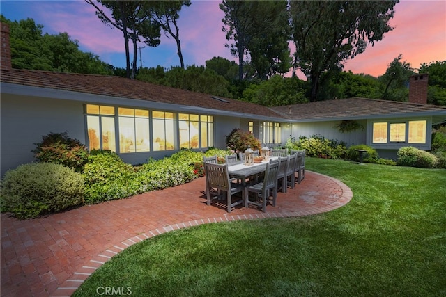 8 Quail Ridge Rd S, Rolling Hills, CA 90274 - rear view of house with a chimney, a yard, and a patio