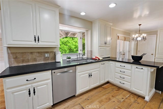 kitchen with stainless steel dishwasher, white cabinets, and light hardwood / wood-style floors