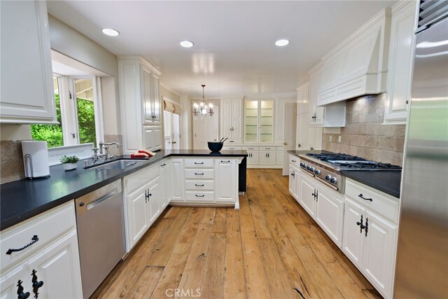 8 Quail Ridge Rd S, Rolling Hills, CA 90274 - kitchen with appliances with stainless steel finishes, a sink, white cabinetry, a chandelier, and recessed lighting