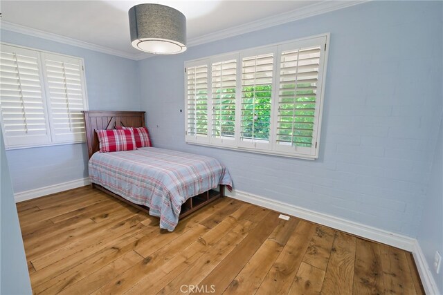 8 Quail Ridge Rd S, Rolling Hills, CA 90274 - bedroom with baseboards, wood-type flooring, and ornamental molding